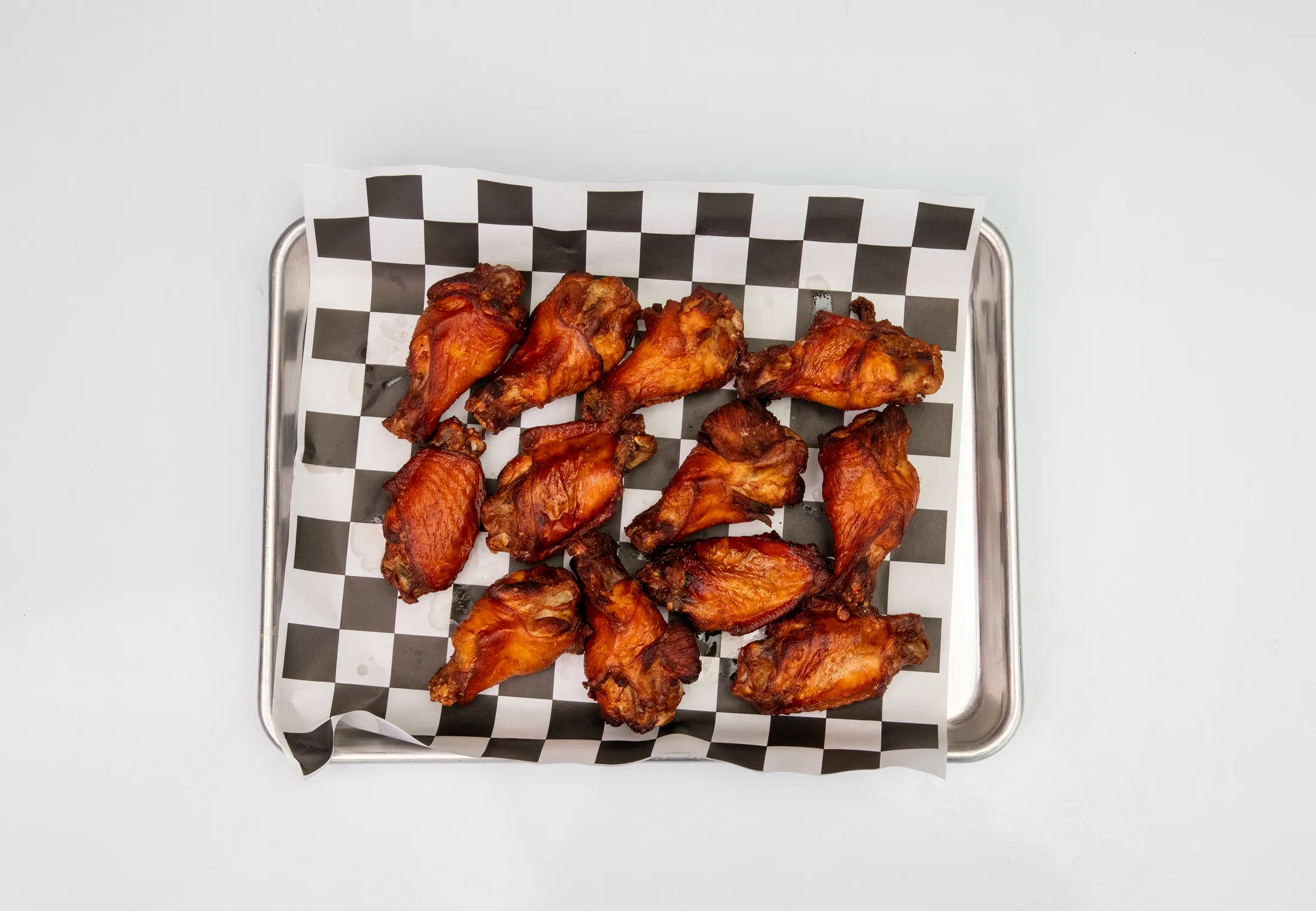 Twelve-piece shareable wing platter with two sauces at The Rusty Roost