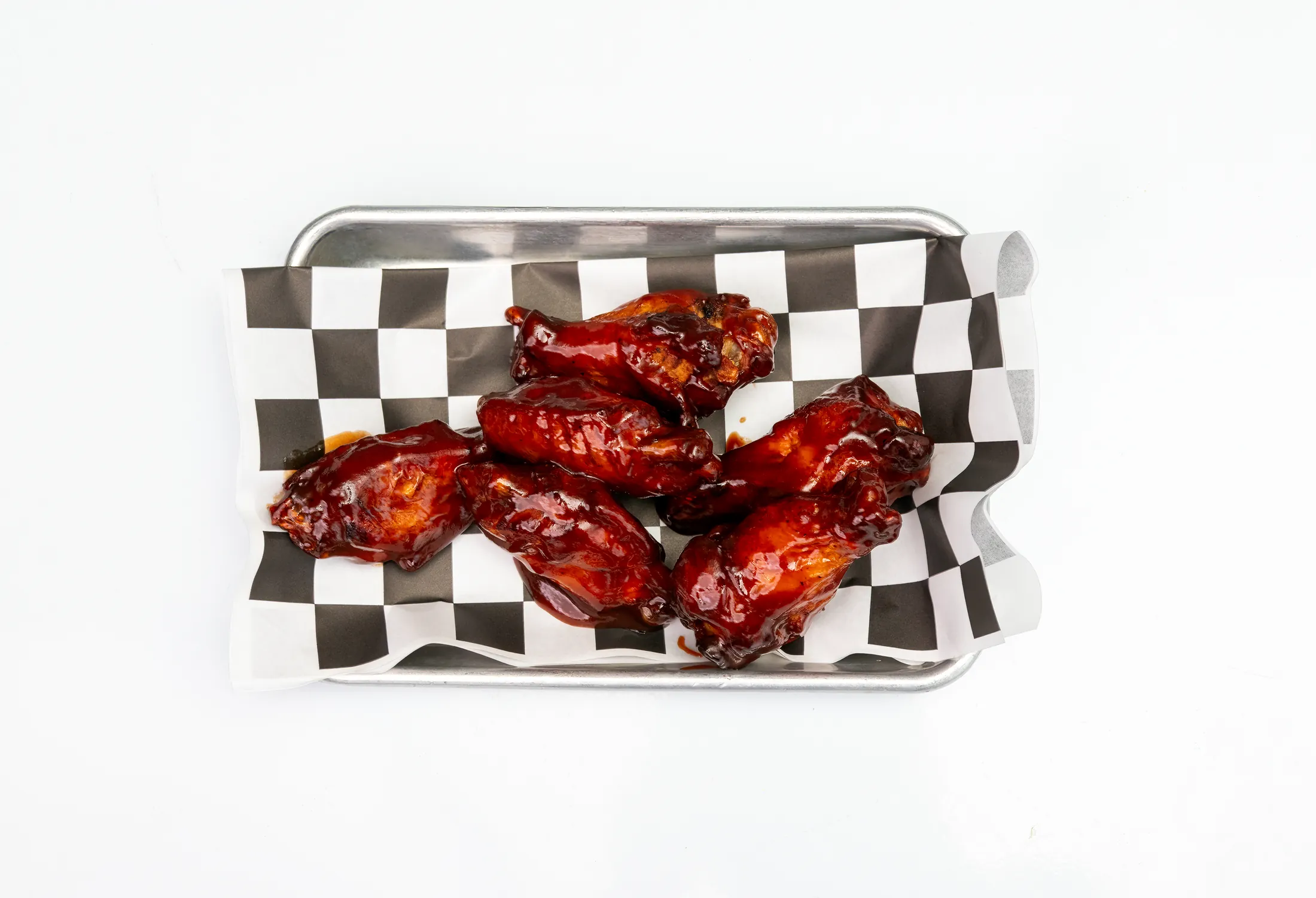 Six-piece jerk wings with mango habanero drizzle at The Rusty Roost