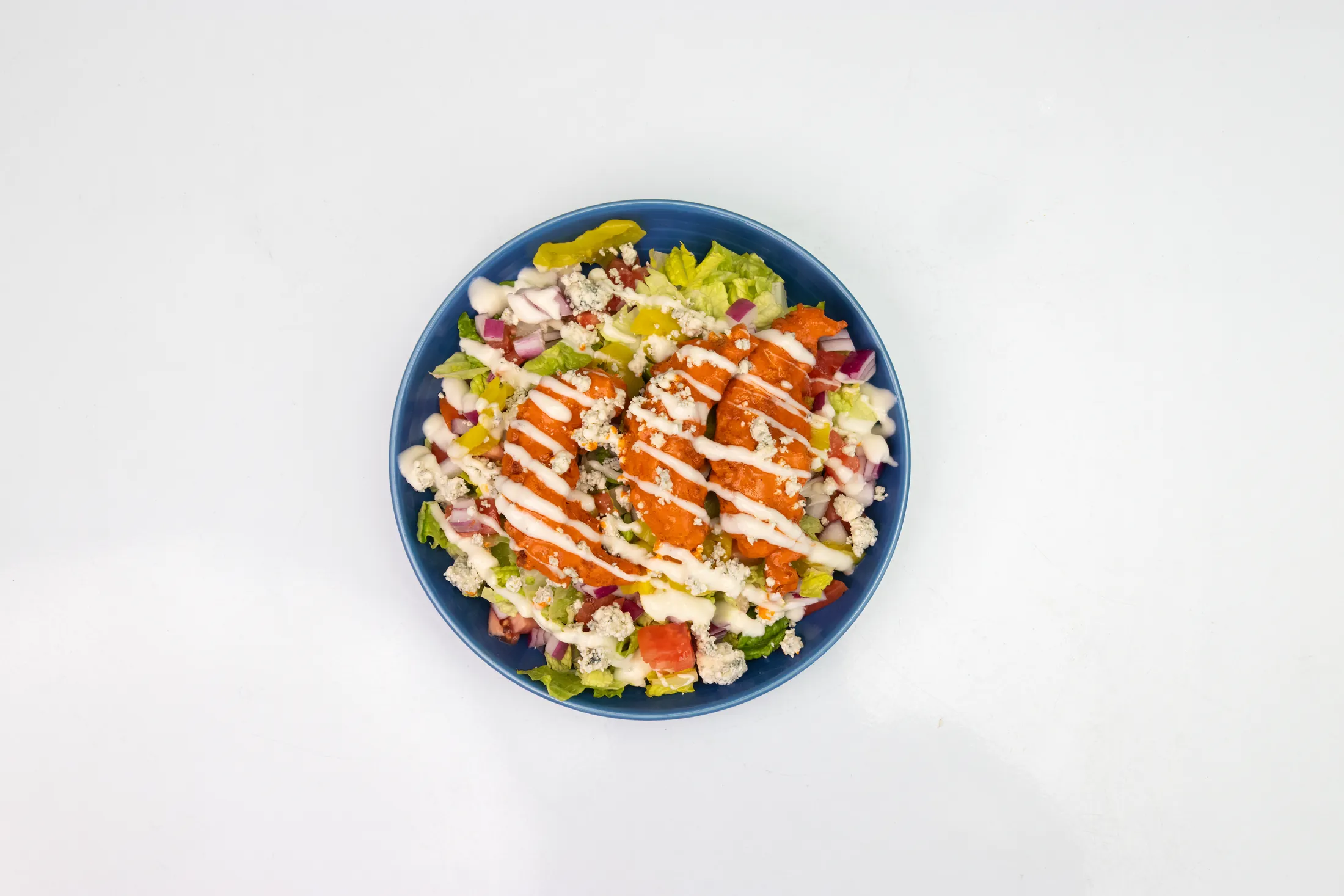 Buffalo chicken salad with mixed greens, buffalo tenders, and ranch at The Rusty Roost