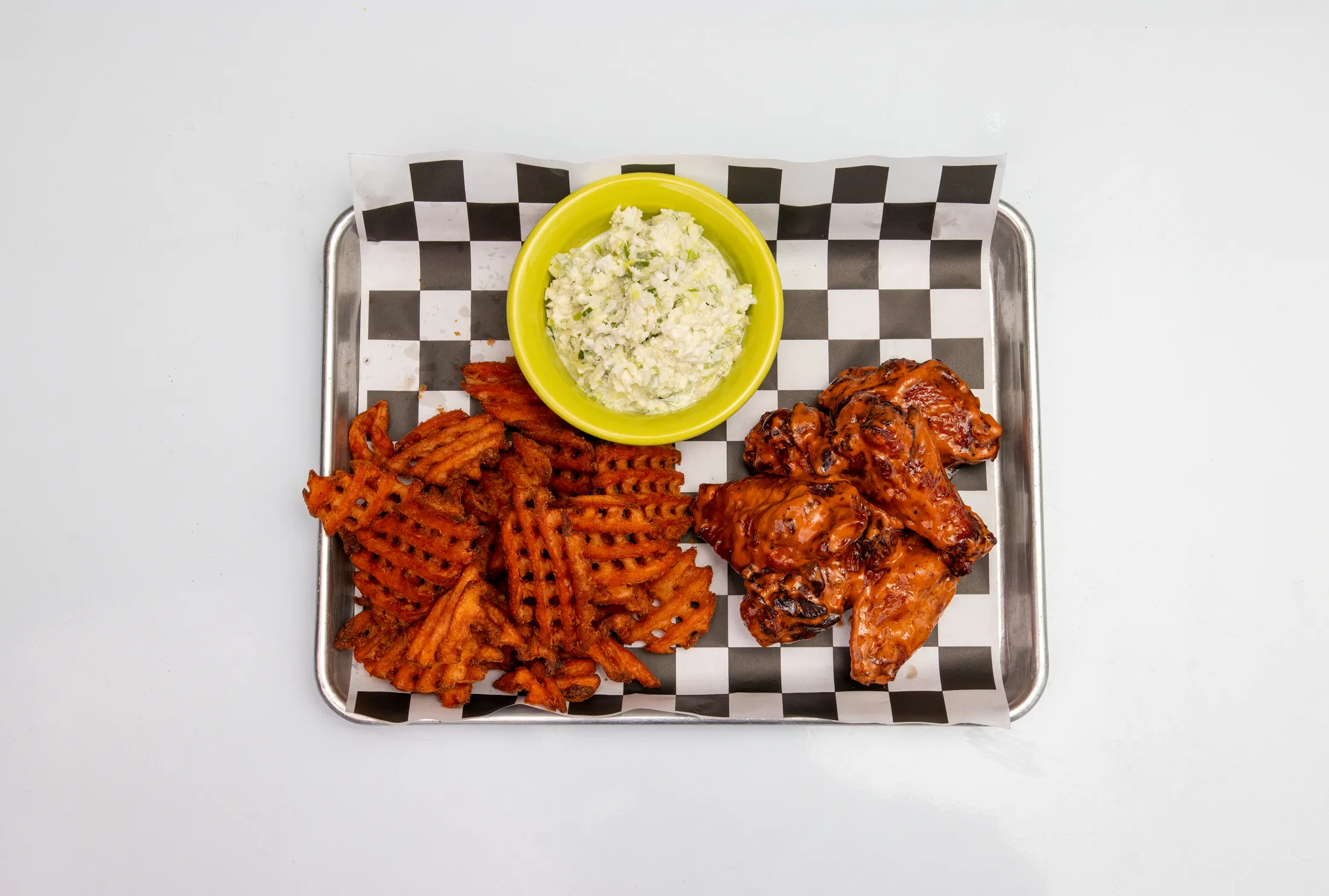 Wing combo with eight wings, curly fries, and a drink at The Rusty Roost